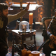 Topher (Haley Joel Osment) simply insists on a high-five from fellow familiar Guillermo (Harvey Guillén).